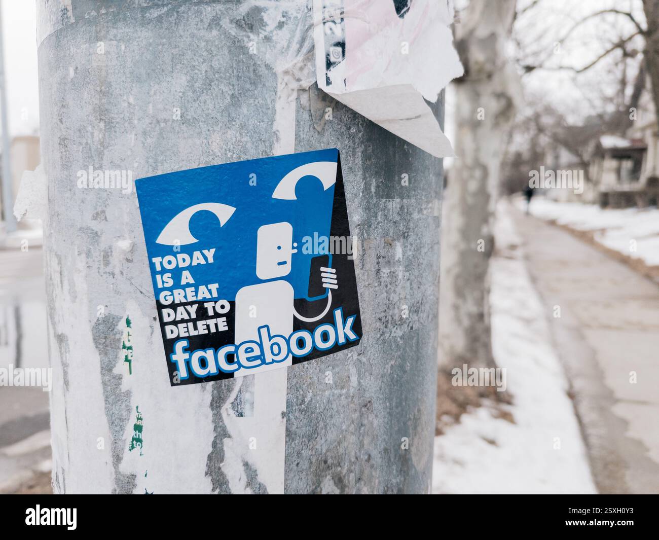 Today is a Great Day to Delete Facebook sticker on a pole in Ann Arbor Michigan USA - Smartphone Captured Stock Image