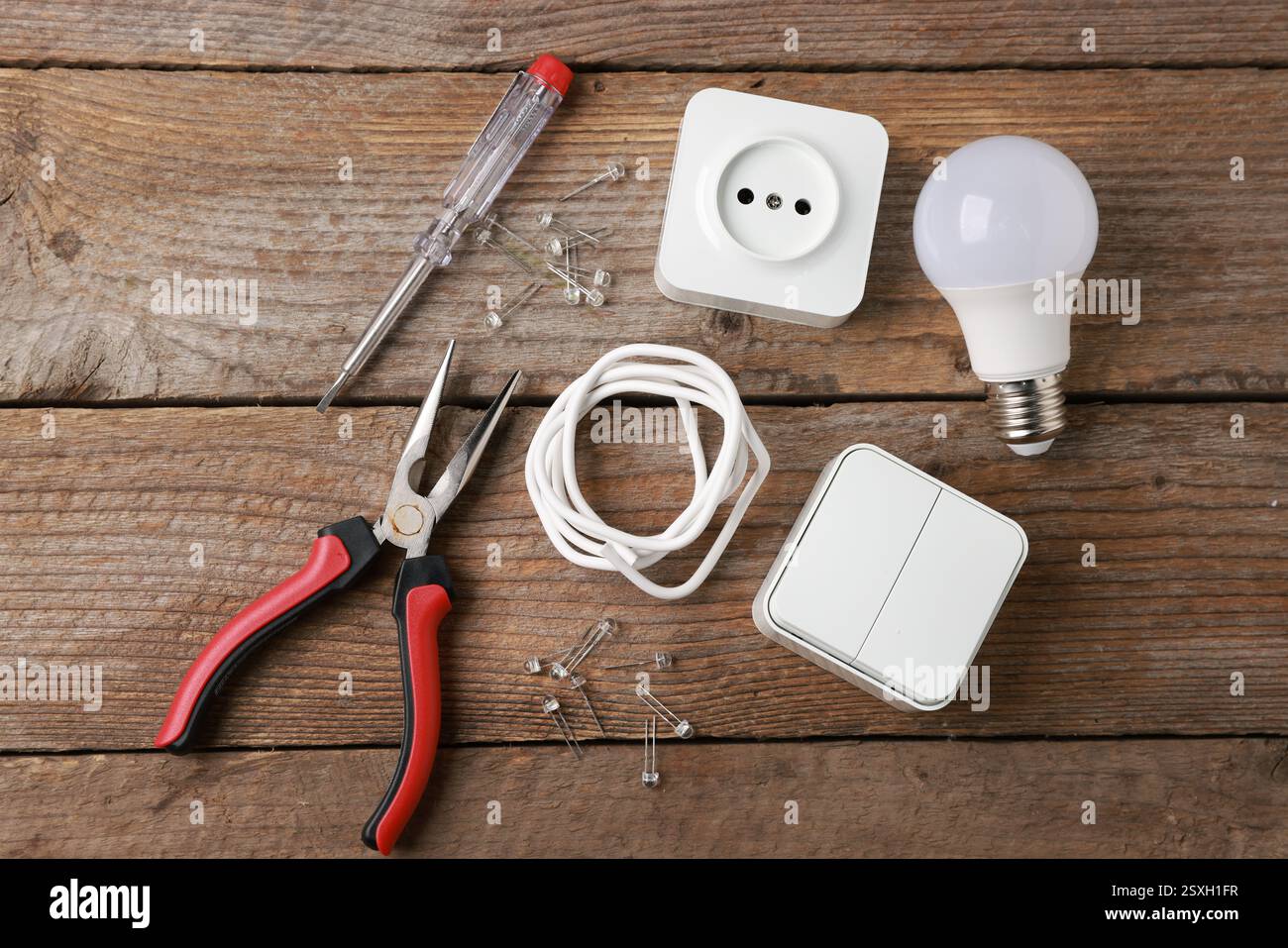 Different electrical tools on wooden table, flat lay Stock Photo