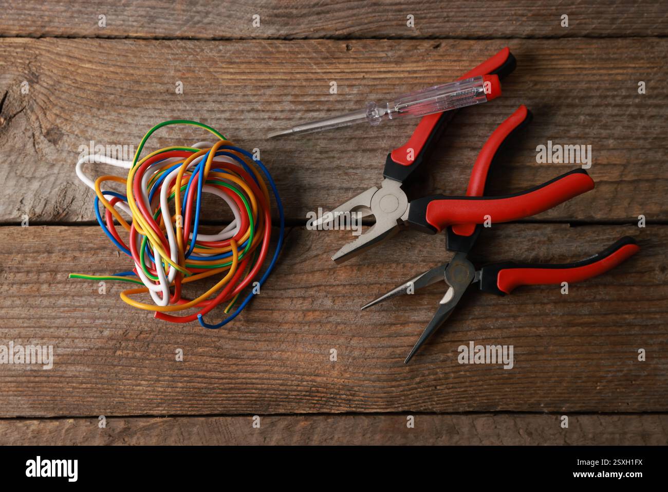 Different electrical tools on wooden table, flat lay Stock Photo