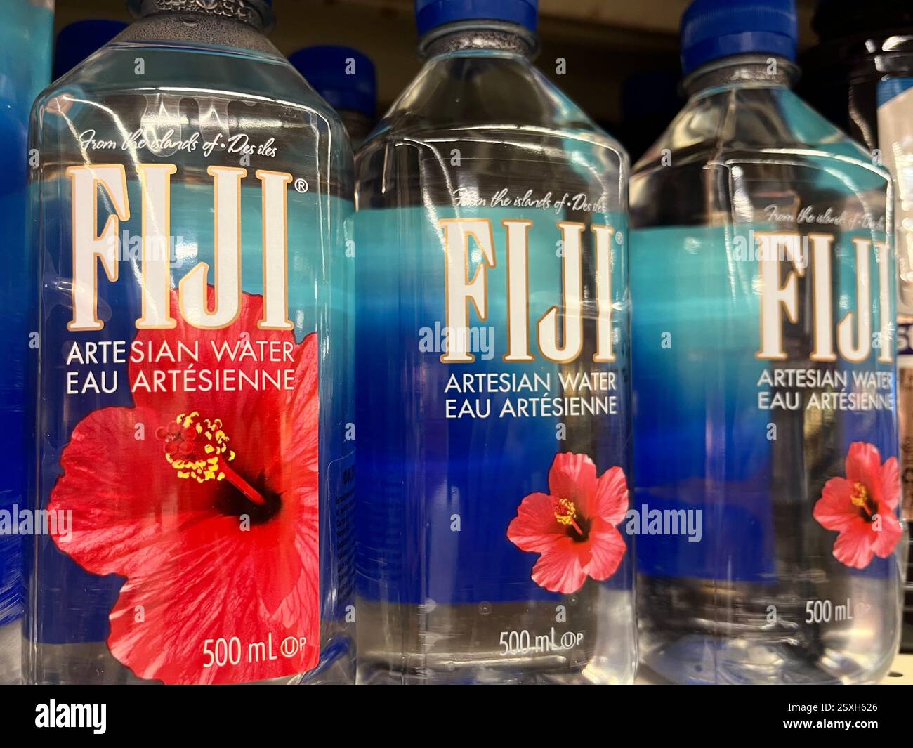 Fiji Artesian Water bottles displayed on retail shelf - Smartphone Captured Stock Image