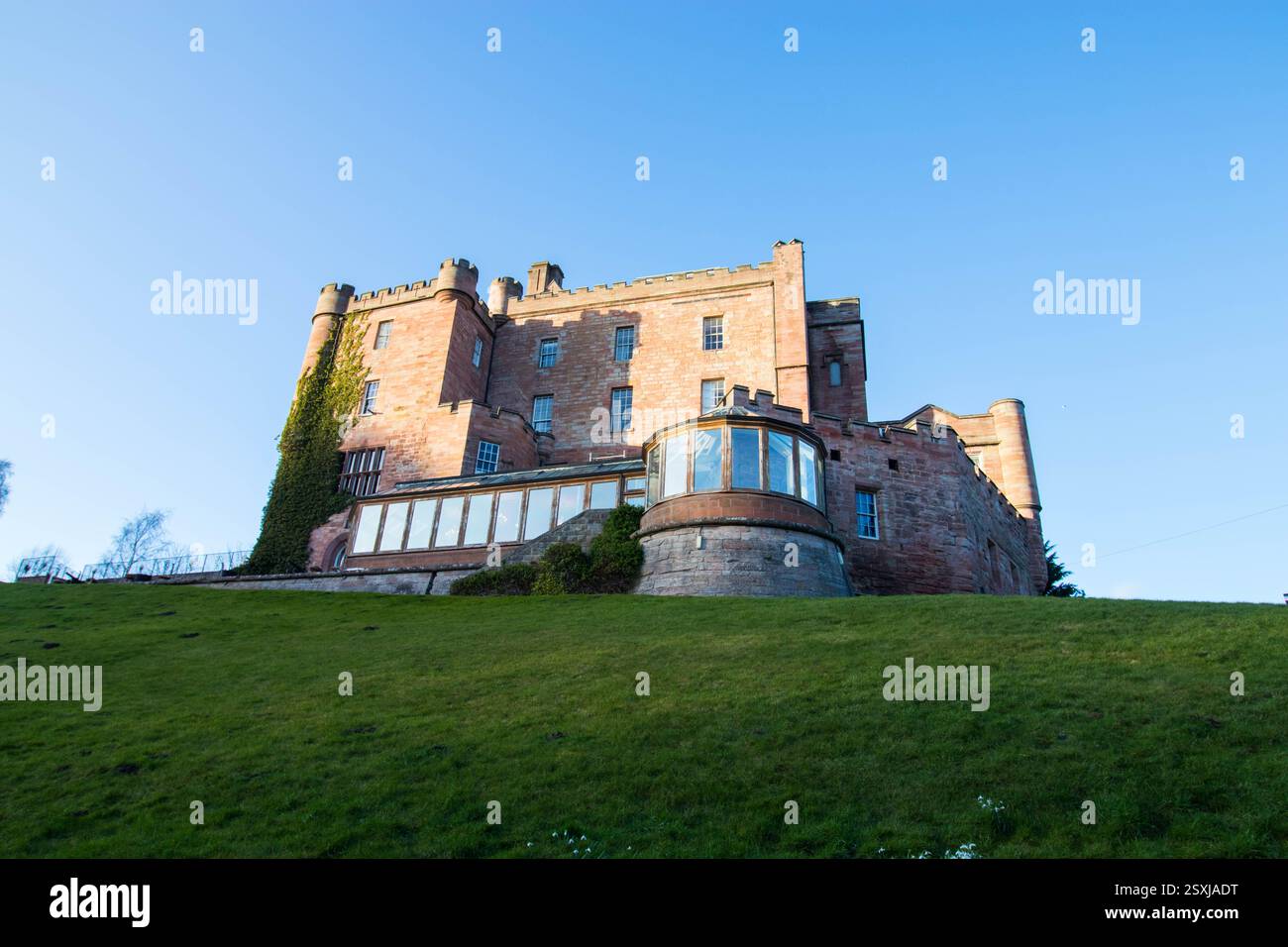 Dalhousie castle hotel in Cockpen, Midlothian, Scotland. Photo of the castle from the back with restaurant anex. Stock Photo