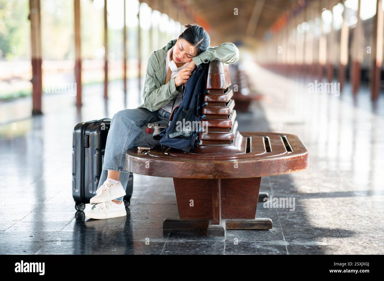 A woman sleeping on a train hi-res stock photography and images - Alamy