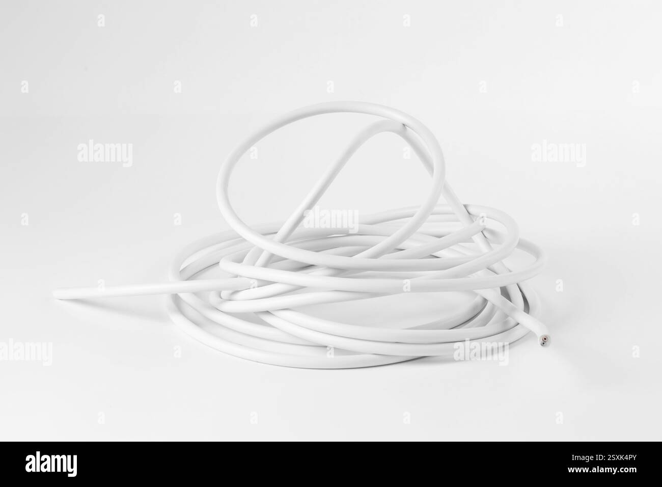 Tangled insulated electrical wire isolated on white Stock Photo