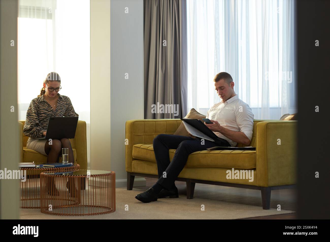 Collaborating on Project in Modern Office Lounge Stock Photo