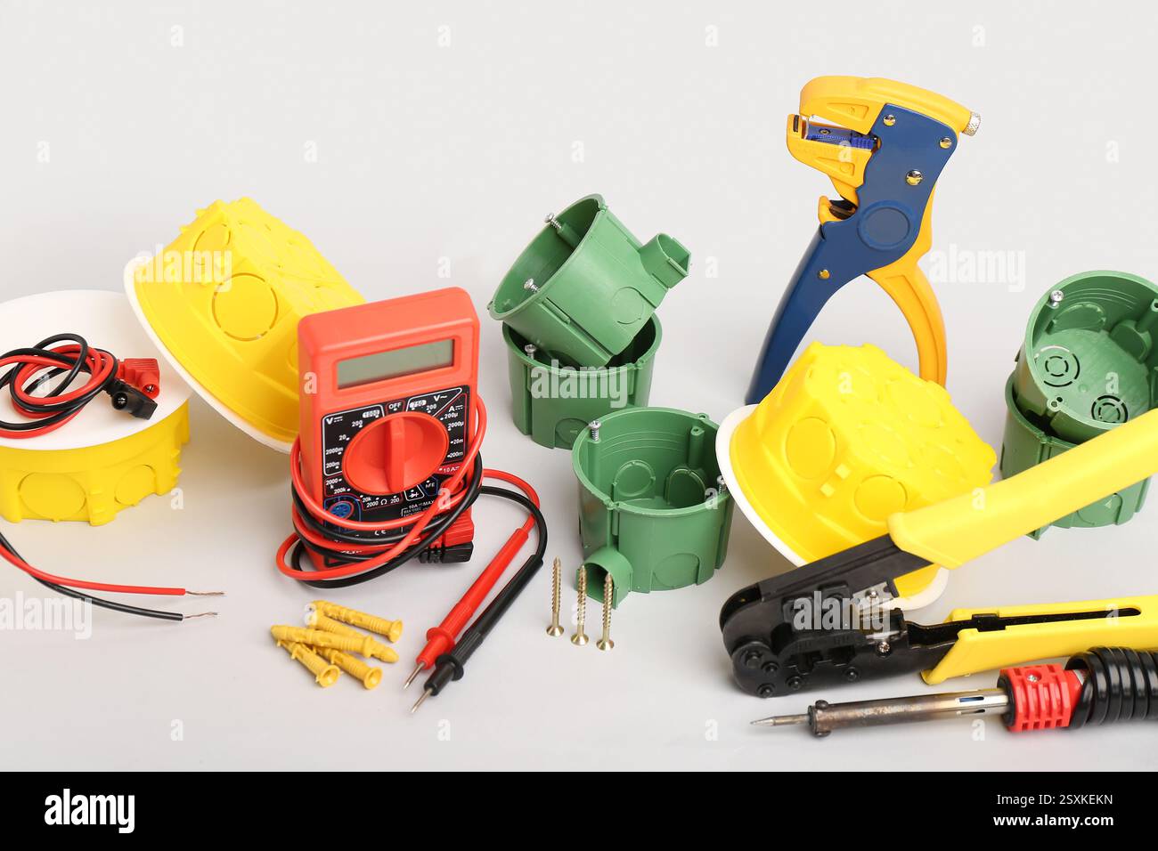 Different electrician's tools on light background Stock Photo