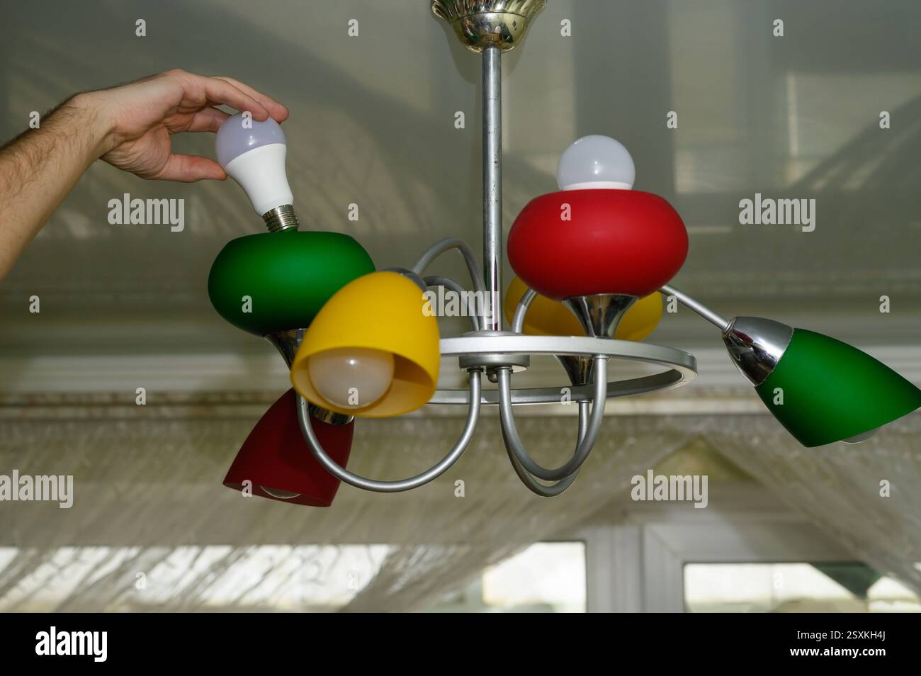 replacing the LED light bulb. energy efficiency Stock Photo