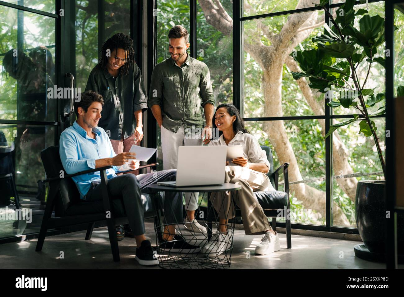 Mixed team of software engineers brainstorming ideas. Diverse app developers collaborating as group Stock Photo