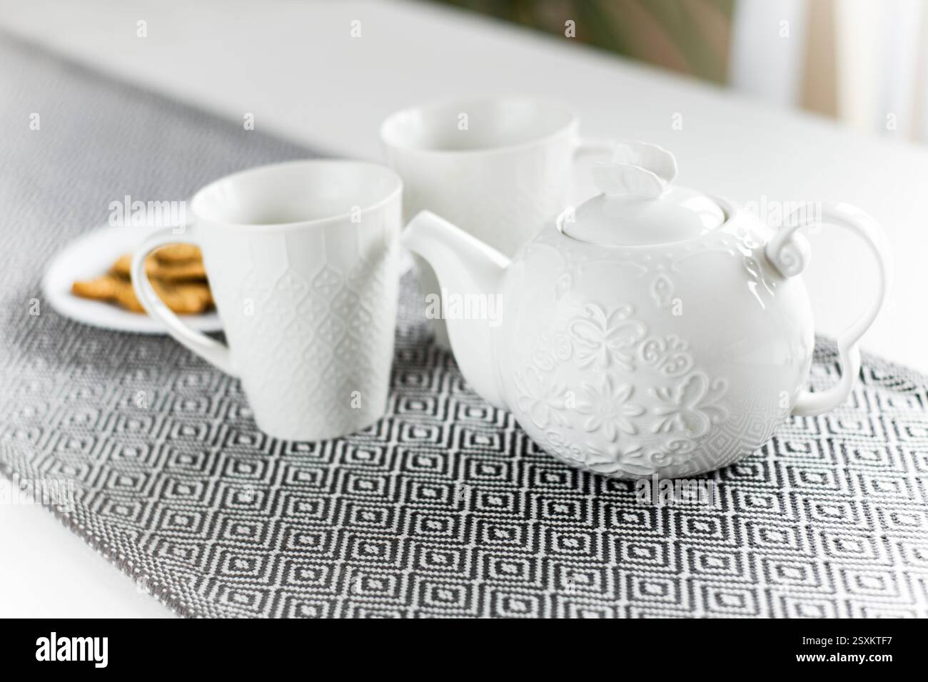White ceramic tea set with cookies Stock Photo