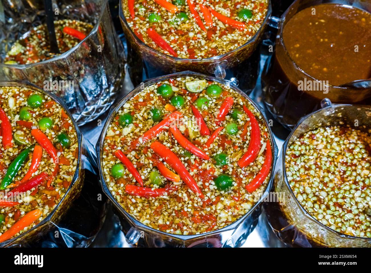 Appetisingly arranged spice marinades at a stall during the night market in the historical center of Hanoi. Stock Photo
