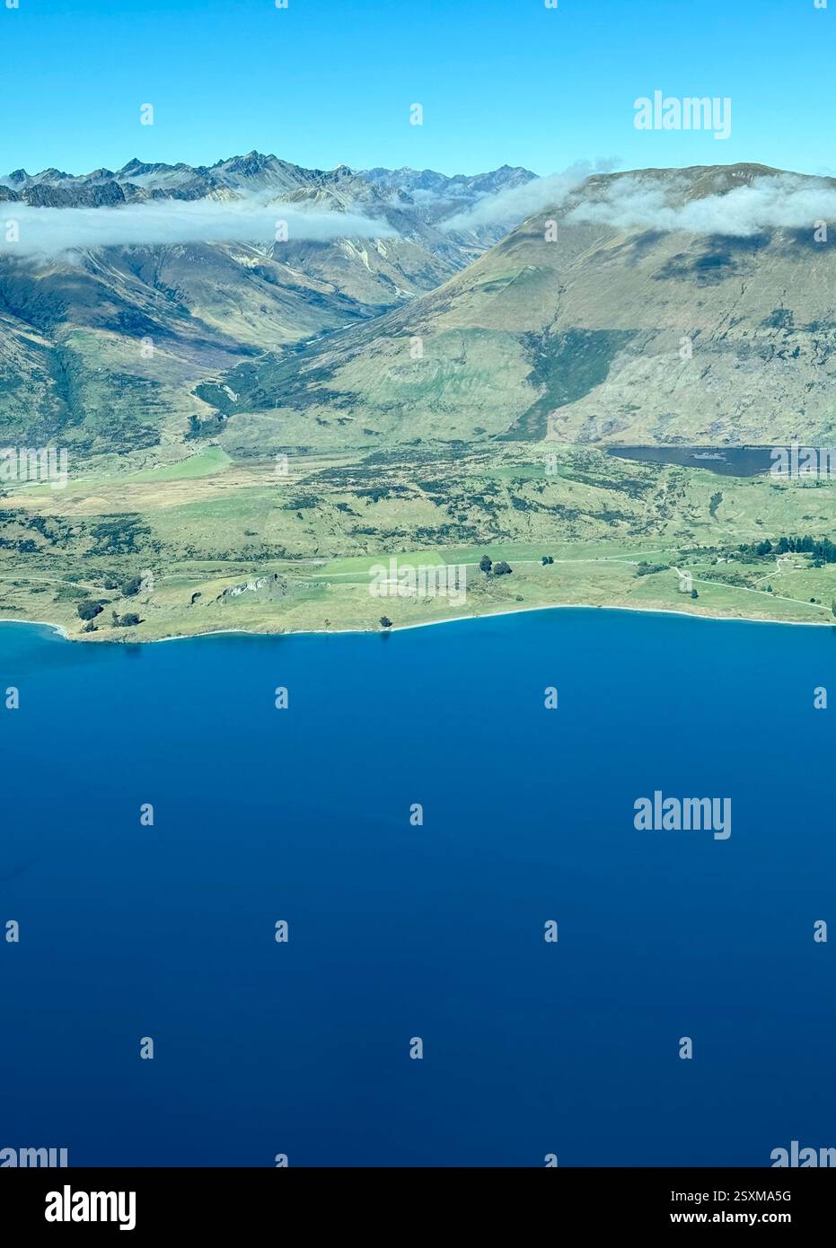 Aerial photo from a small aeroplane of the Southern Alps between Queenstown and Milford Sound - Smartphone Captured Stock Image