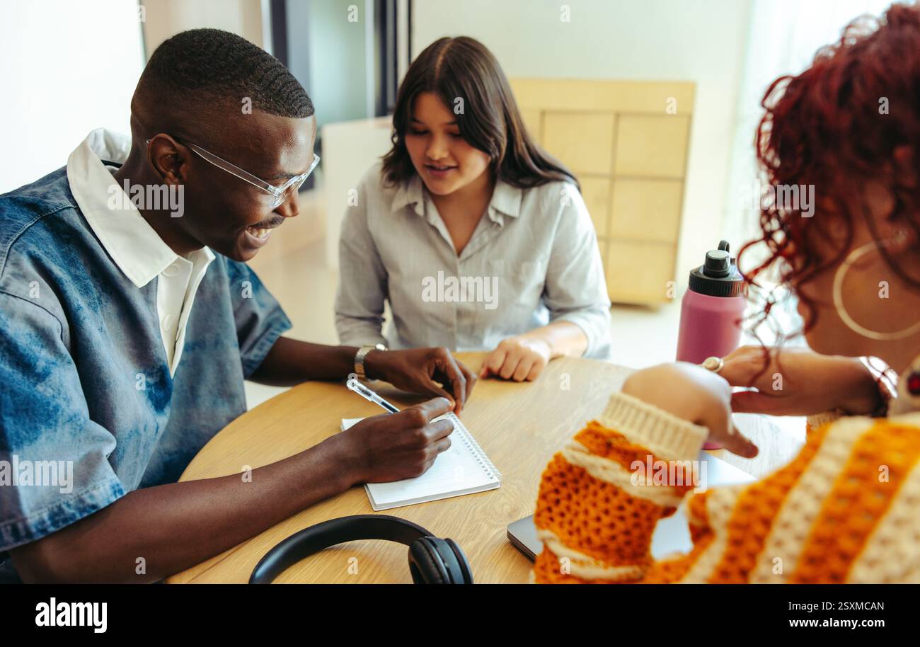 Three friends engage in a study session to prepare for exams ...