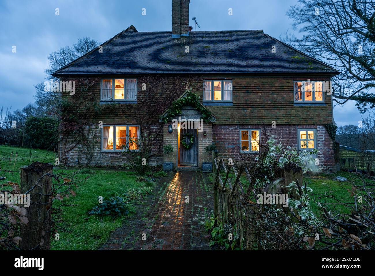 Christmas wreath on front door of traditional East Sussex Tudor farmhouse dating from 1540, England, UK. Stock Photo