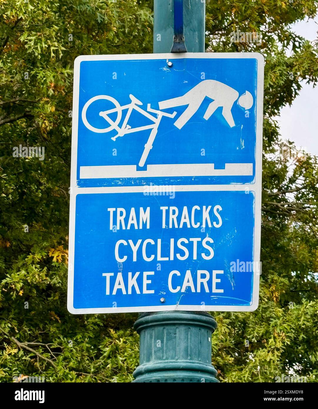 Sign warning cyclists of tram tracks a hazard for cyclists. - Smartphone Captured Stock Image