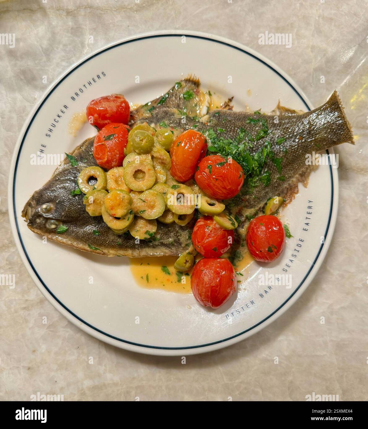 Grilled flounder fish at The Shucker Brothers Seafood Restaurant Auckland New Zealand - Smartphone Captured Stock Image