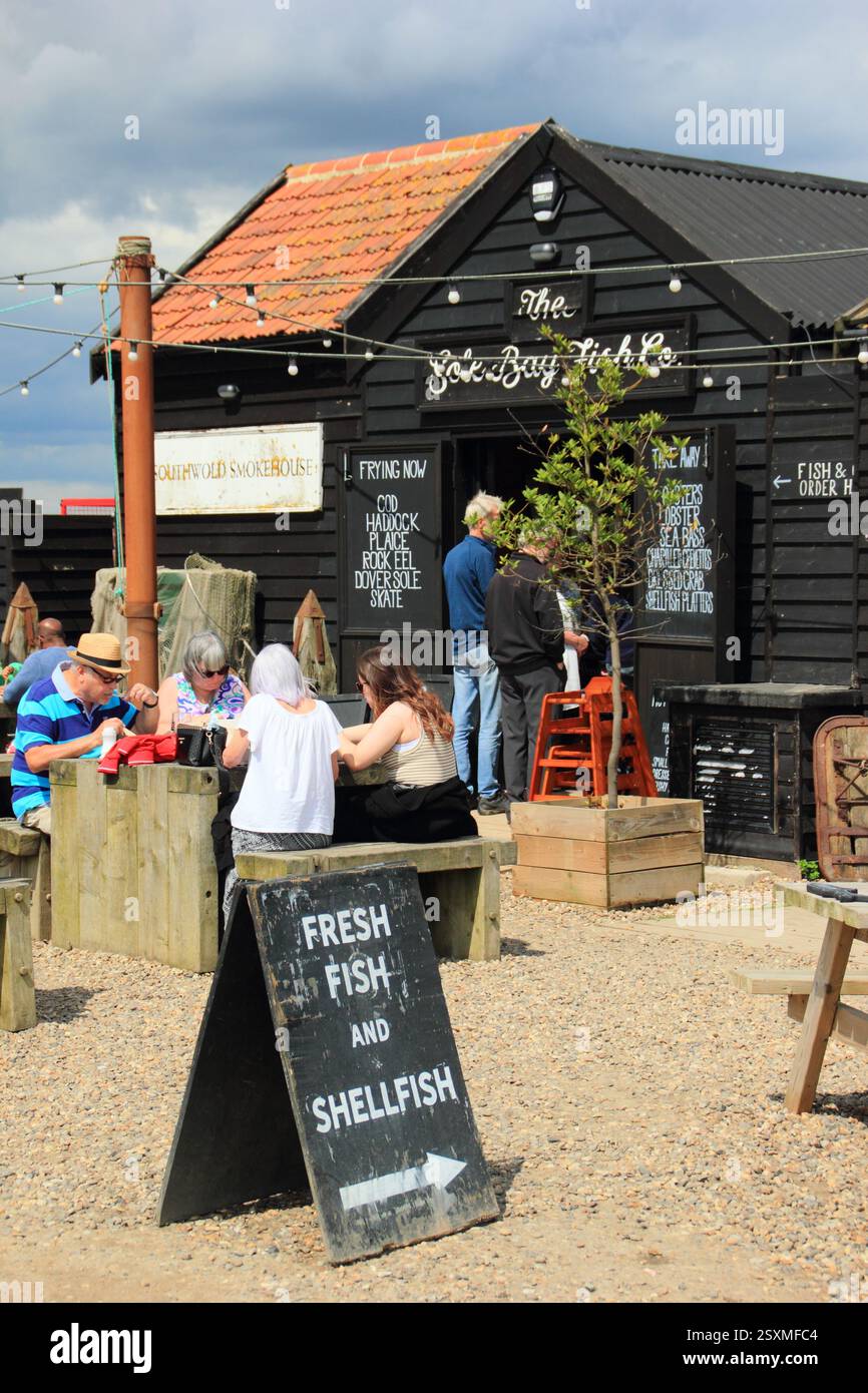 Southwold smokehouse and Sole Bay Fish Company, Blackshore, Southwold, Suffolk. Traditional smokehouse and eatery on Southwold harbour in summer. Stock Photo
