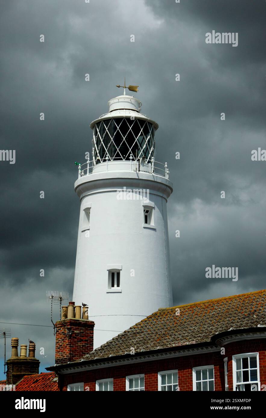 Southwold lighthouse on a heavily clouded summer day. Southwold, Suffolk, East of England, UK. Stock Photo