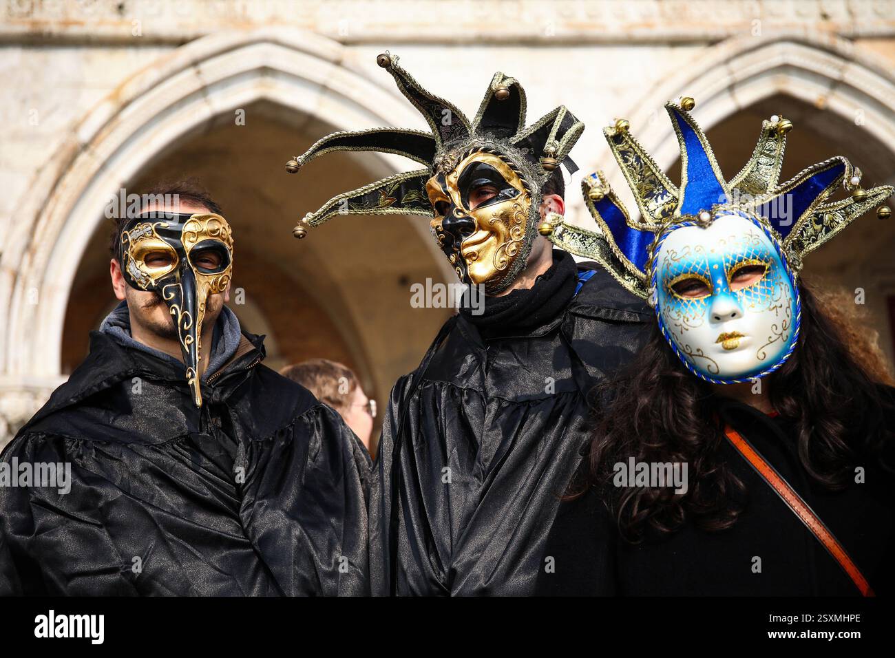 Masked revellers take part in the Venice Carnival at St. Mark's Square ...