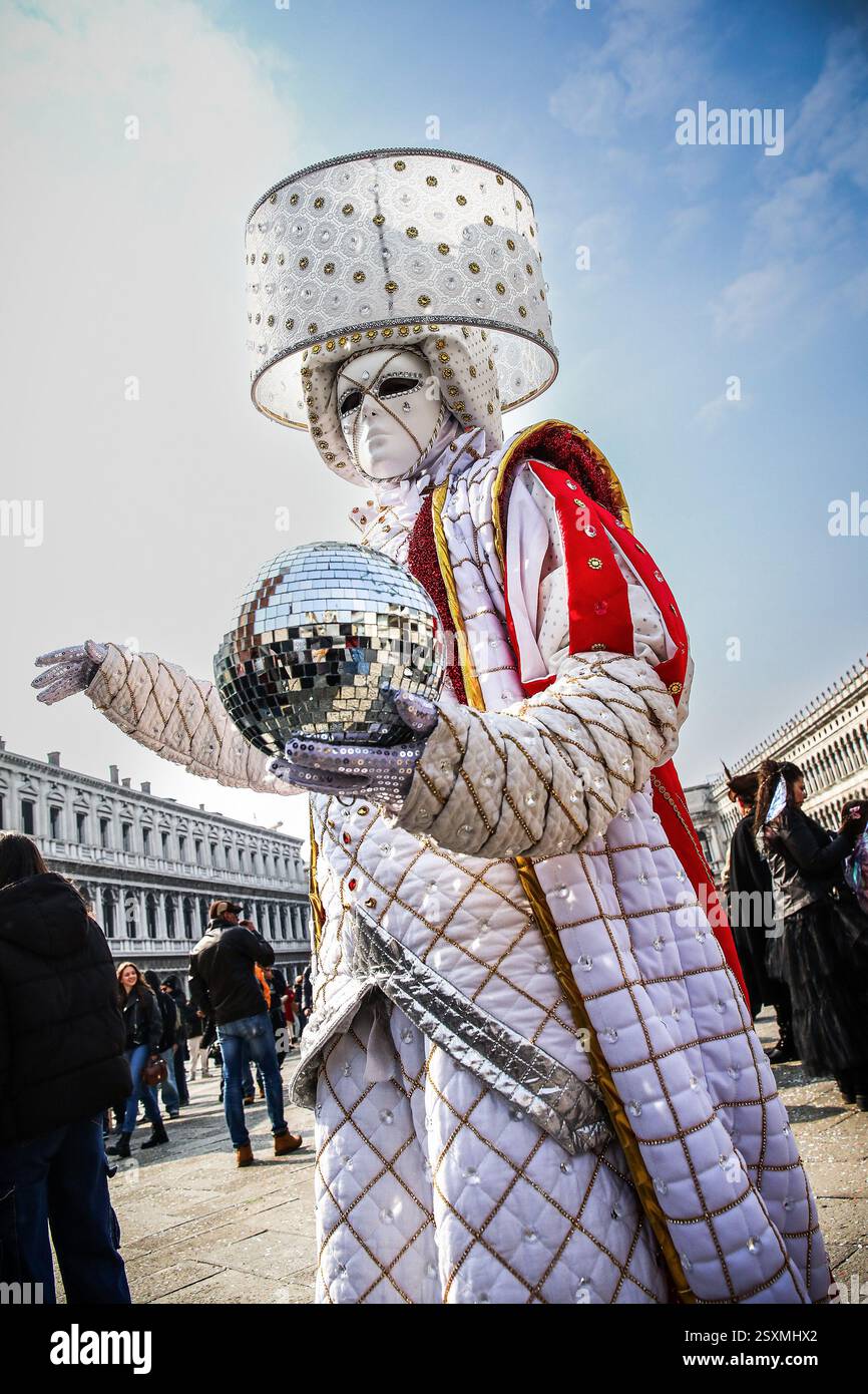 Masked revellers take part in the Venice Carnival at St. Mark's Square ...