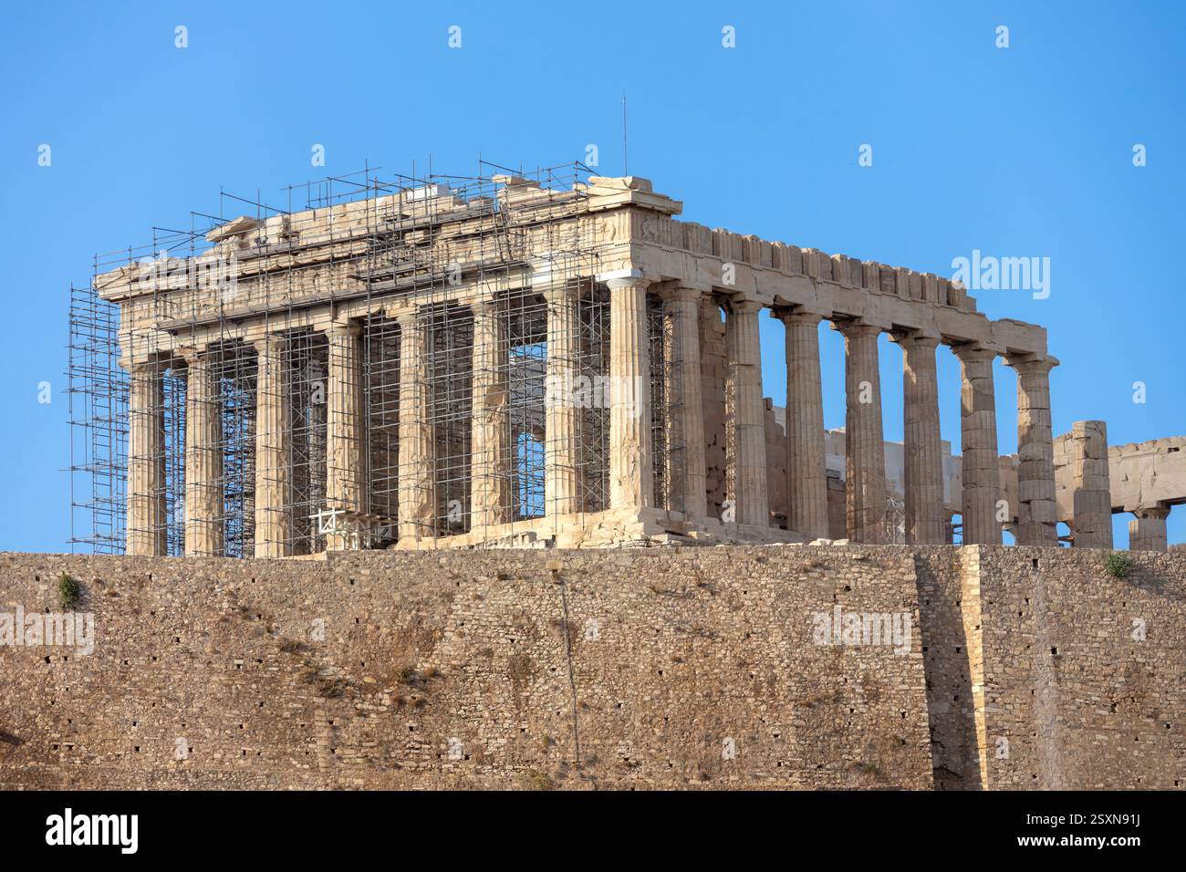The Parthenon, part of the Acropolis of Athens. Situated on a rocky outcrop overlooking the ancient city in Greece. Stock Photo