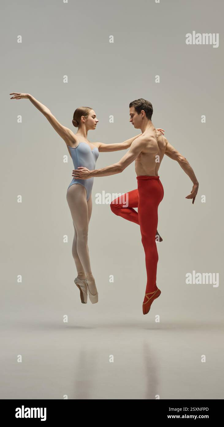 Ballet Dou Ballet duo in graceful lift with extended lines and sculpted posture ...