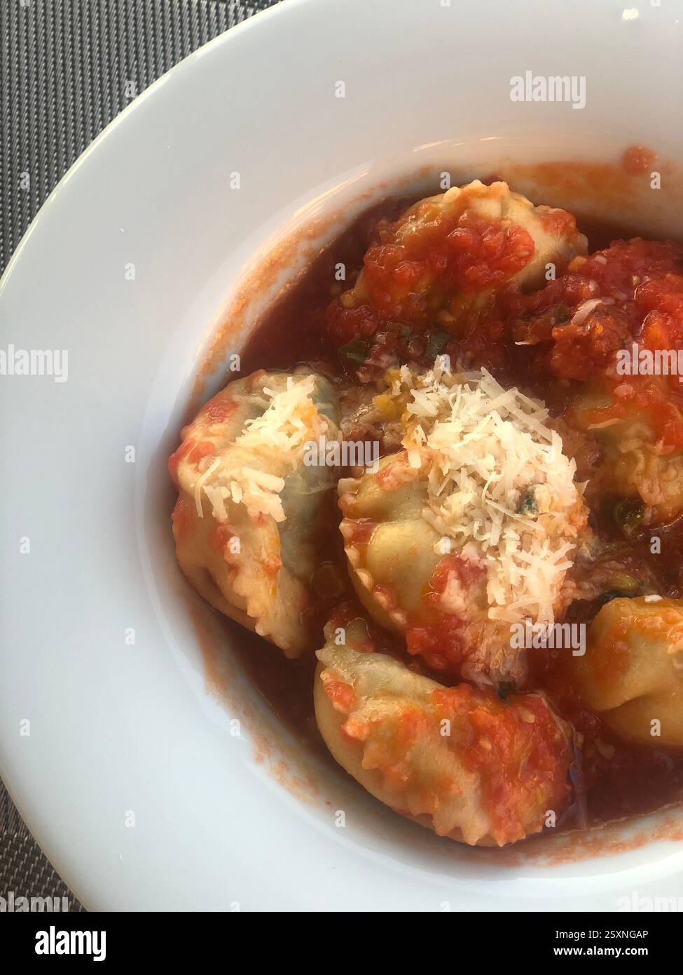 Homemade Ravioli with Tomato Sauce and Parmesan - Smartphone Captured Stock Image