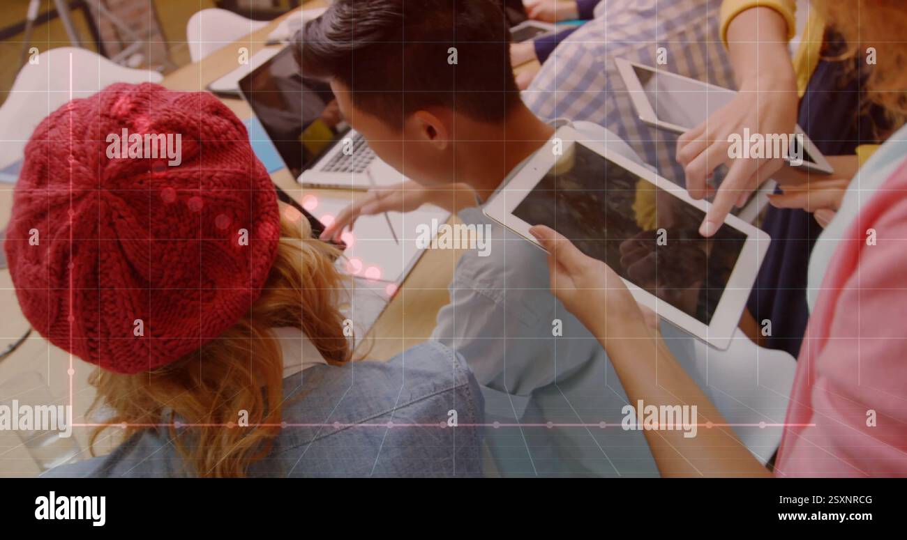 Graph and data points image over people working with tablets and laptops Stock Photo