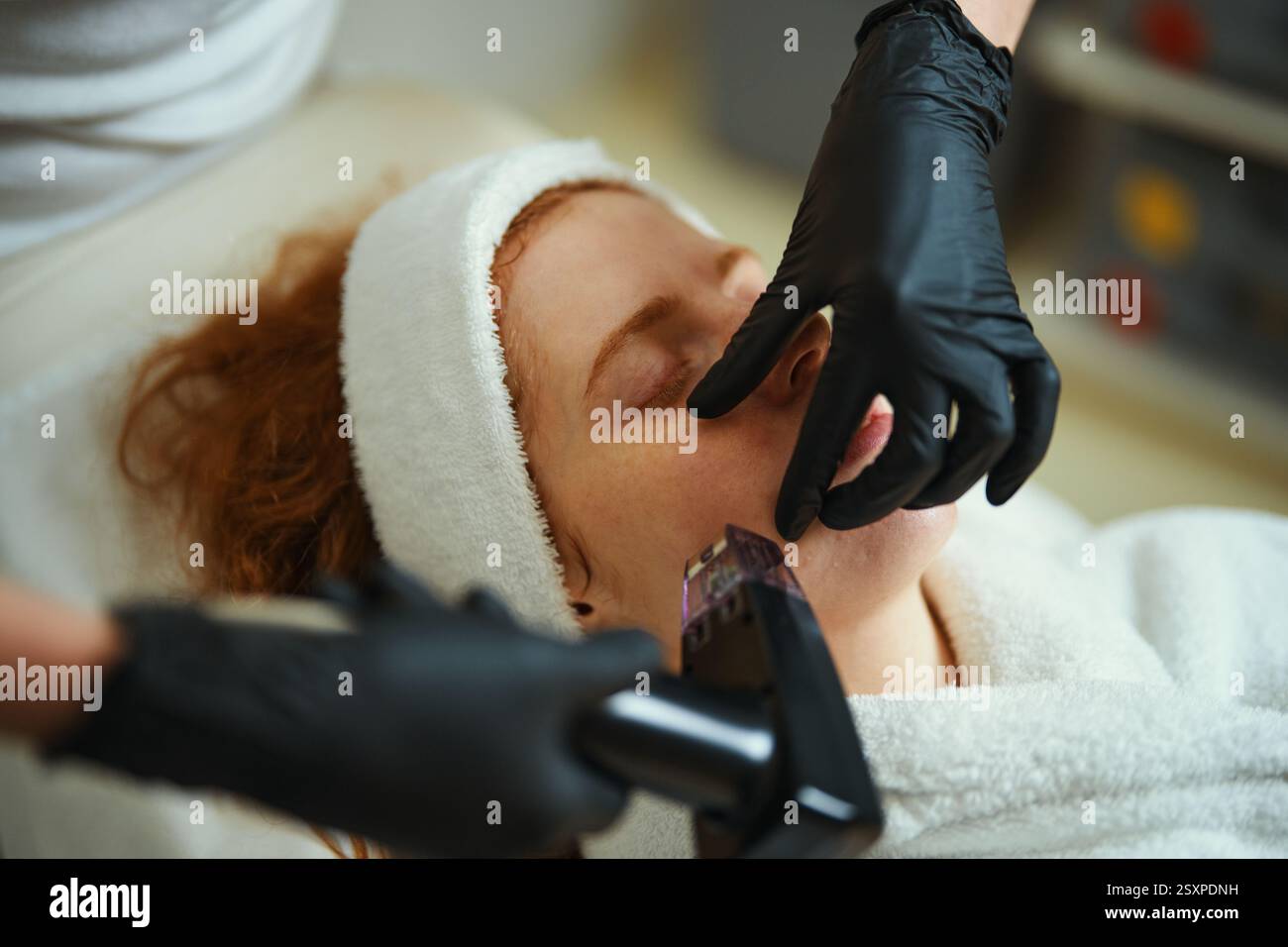 Skin treatment session at a spa with a focus on facial rejuvenation ...