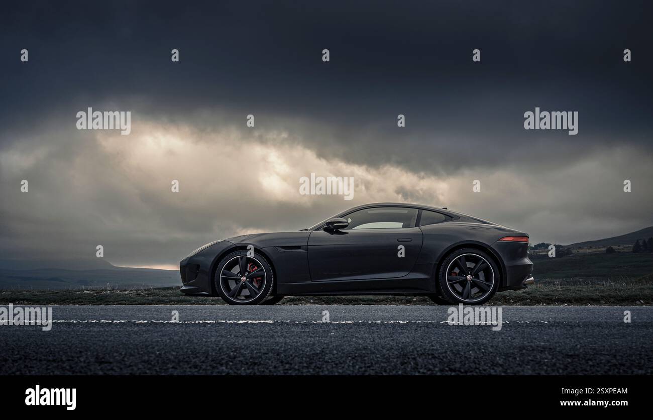 Jaguar F-Type R in dramatic landscape Stock Photo