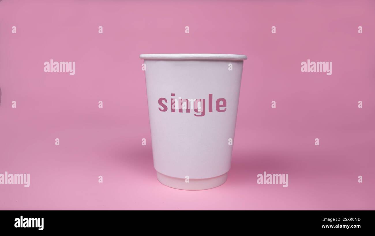 Single cup isolated on pink background. Stock Photo