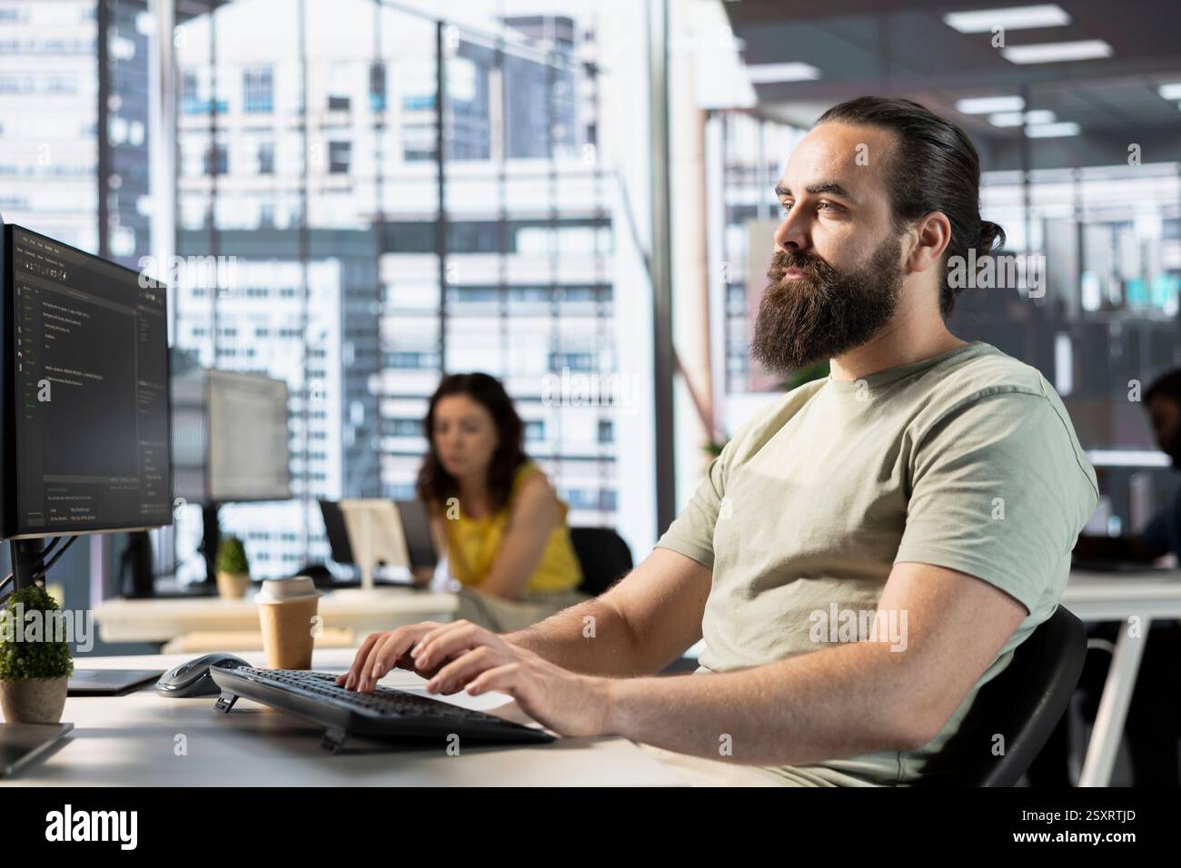 Data scientist doing software quality assurance, reading source code on computer before implementing it. IT employee in office inspecting coding on PC device, looking to fix potential issues Stock Photo
