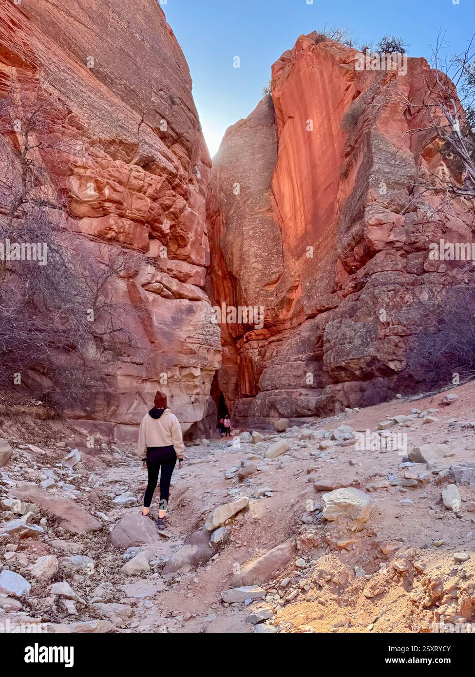 Girl in front of slot canyon - Smartphone Captured Stock Image