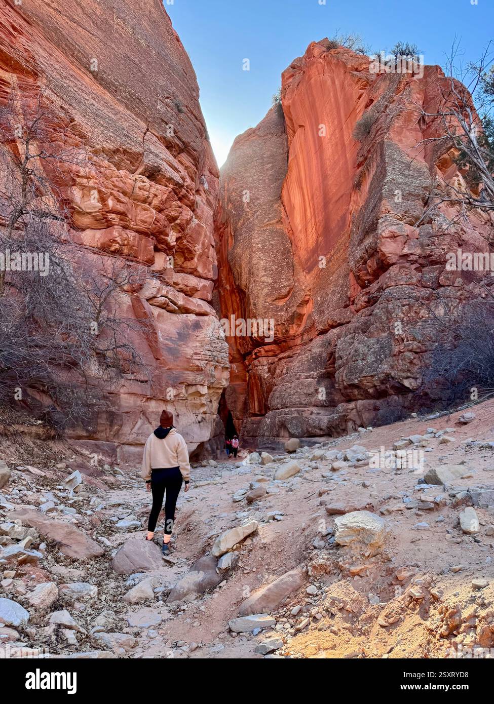 Girl in front of slot canyon - Smartphone Captured Stock Image