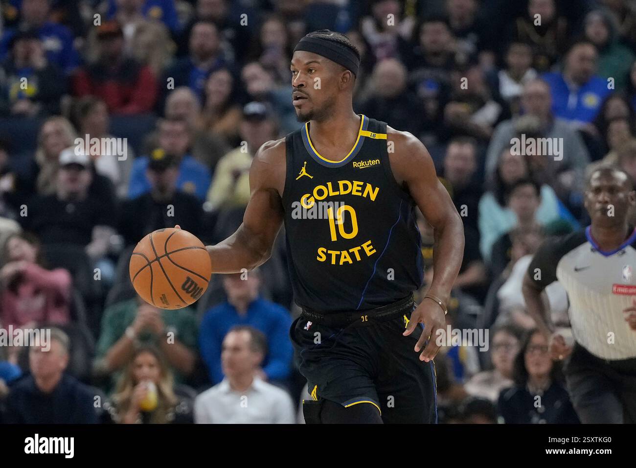Golden State Warriors forward Jimmy Butler III brings the ball up the ...