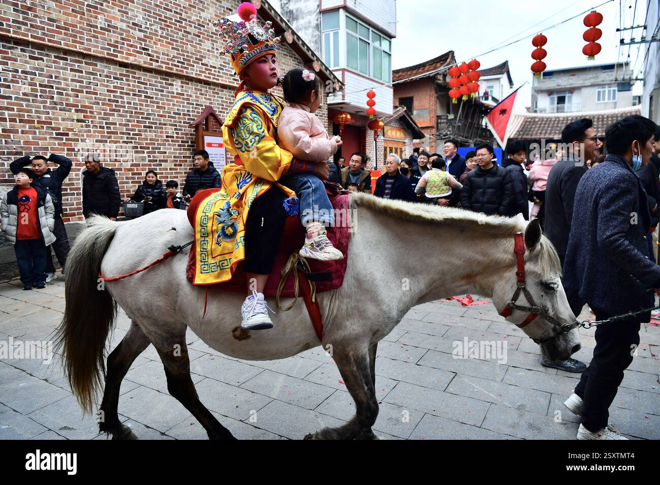 **CHINESE MAINLAND, HONG KONG, MACAU AND TAIWAN OUT** Children ride ...