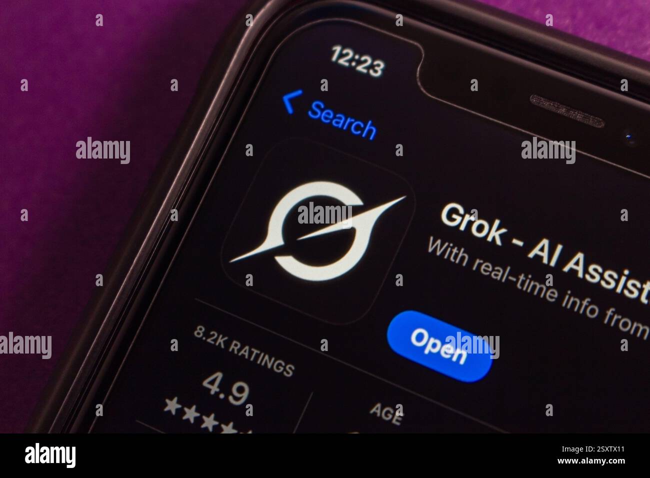 Grok app with a new logo displayed on App Store. Grok is an AI chatbot developed by Elon Musk's xAI, integrated with X to provide real-time info. Stock Photo