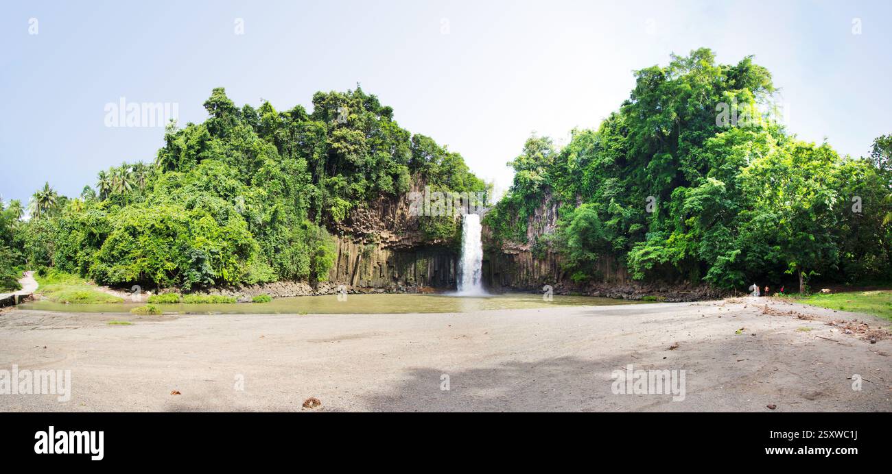 Panoramic view of Cathedral Falls, a cascading waterfall surrounded by lush tropical forest in Lanao del Norte, Philippines Stock Photo