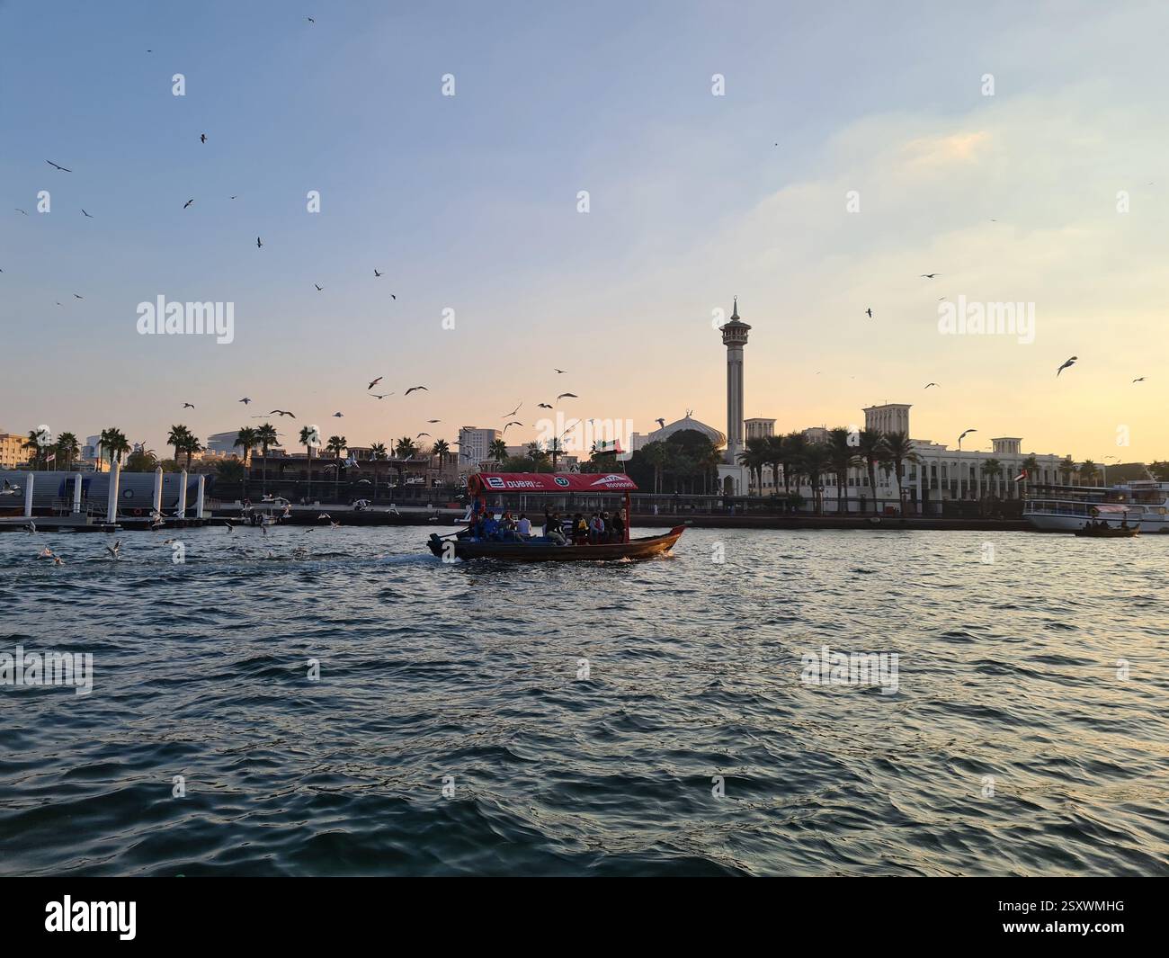 Horizontal Image of a Dubai Abra Ride at Sunset with view over the Creek - Smartphone Captured Stock Image