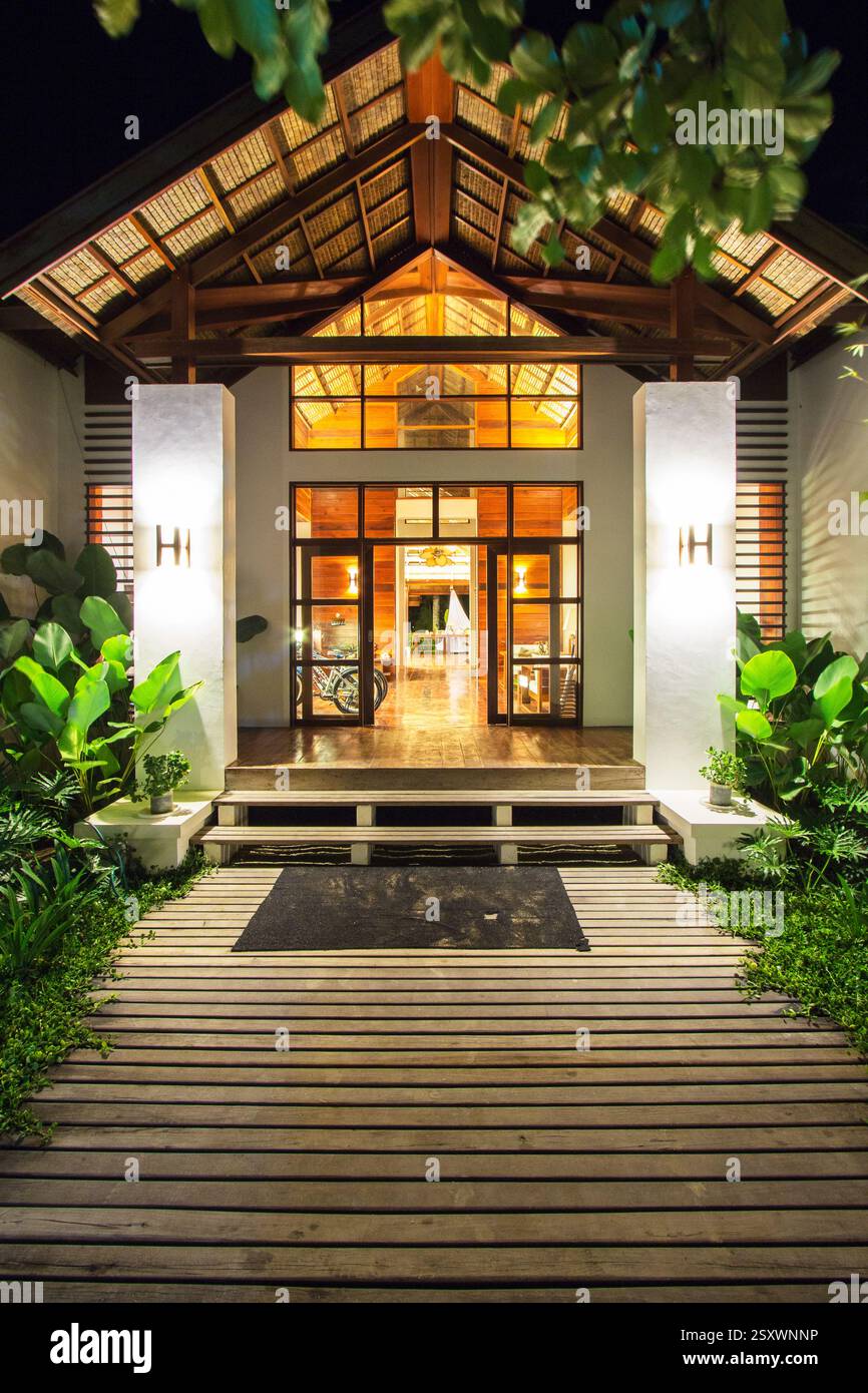 Well-lit entrance of Isla Cabana, a popular private resort, at night in Siargao Philippines Stock Photo