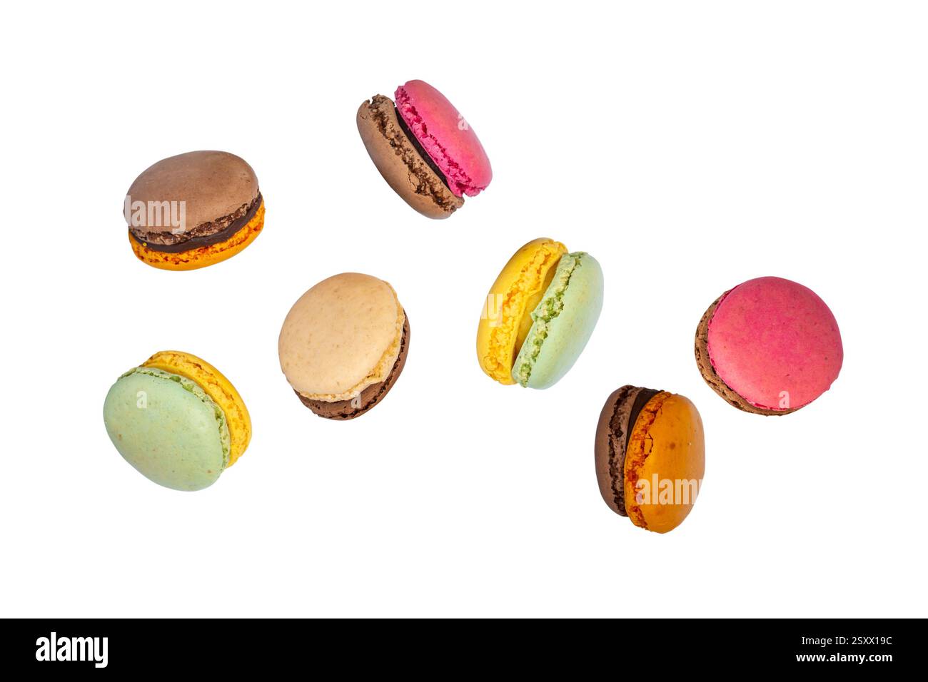 Flying colorful macarons isolated on white background Stock Photo