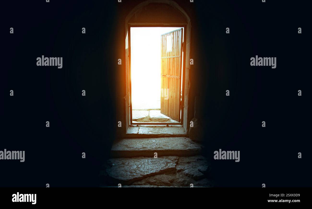 Light entering through open door to a dark empty room Stock Photo - Alamy