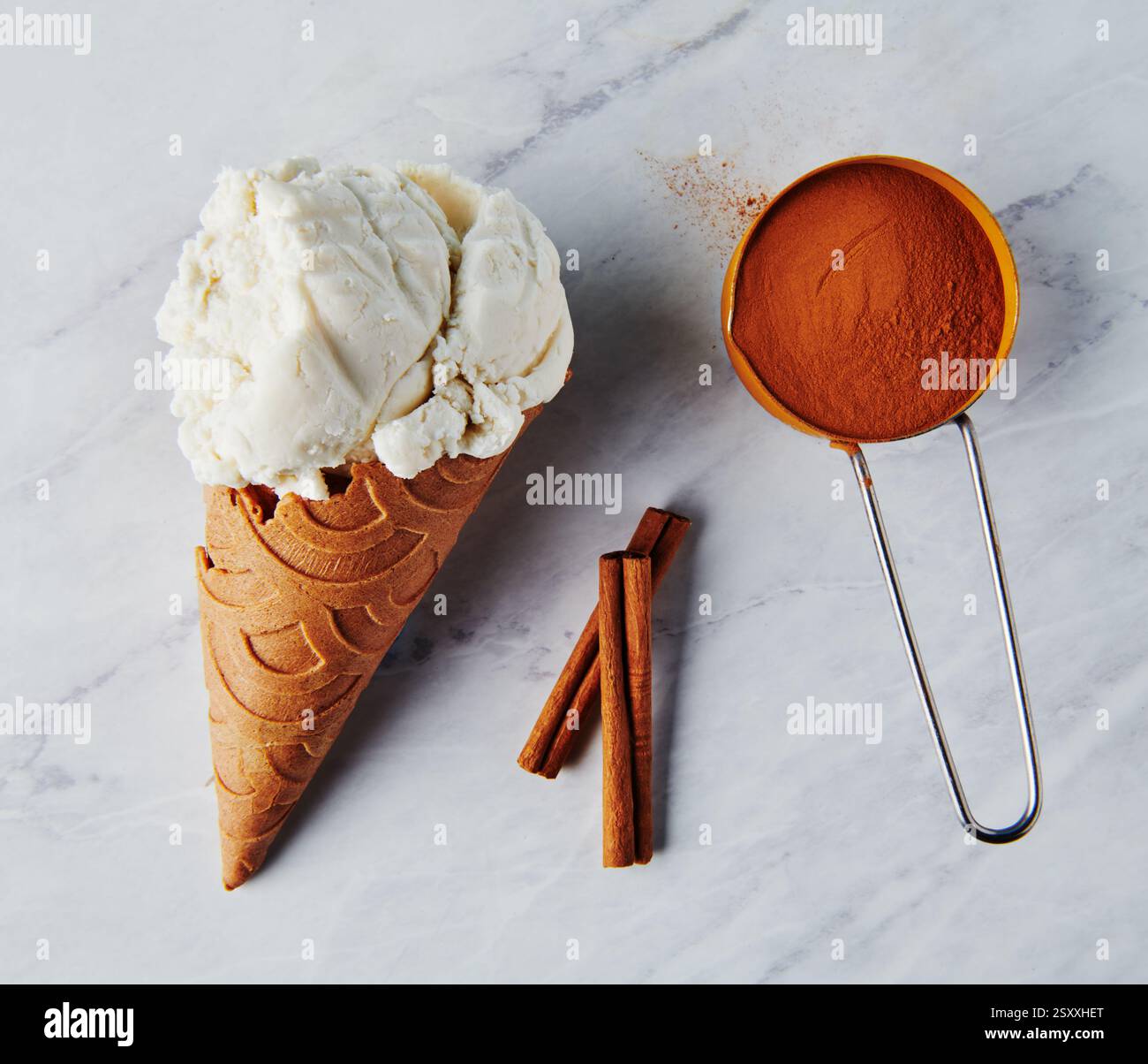 Vanilla ice cream on a cinnamon cone Stock Photo