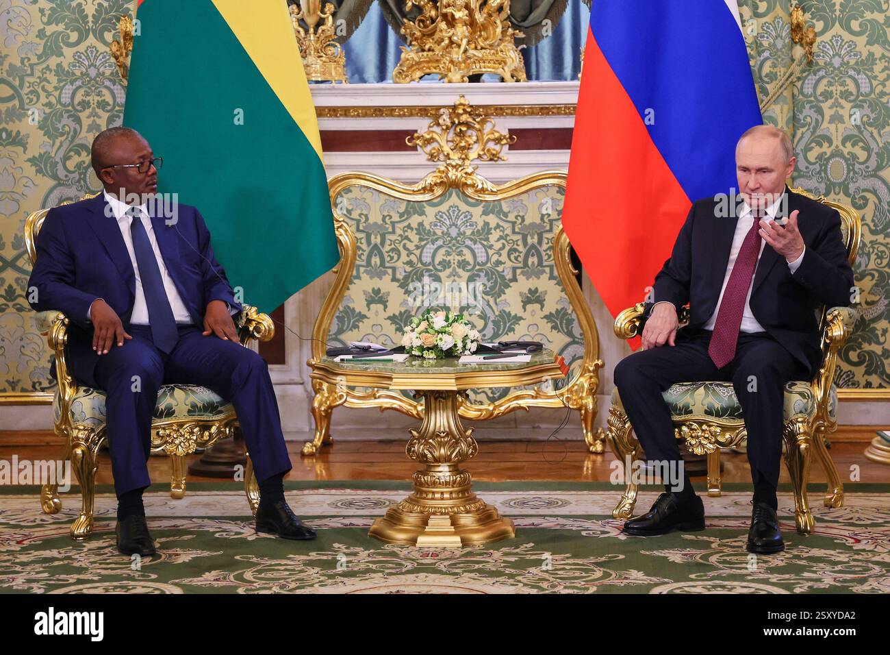Russian President Vladimir Putin, right, gestures while speaking with