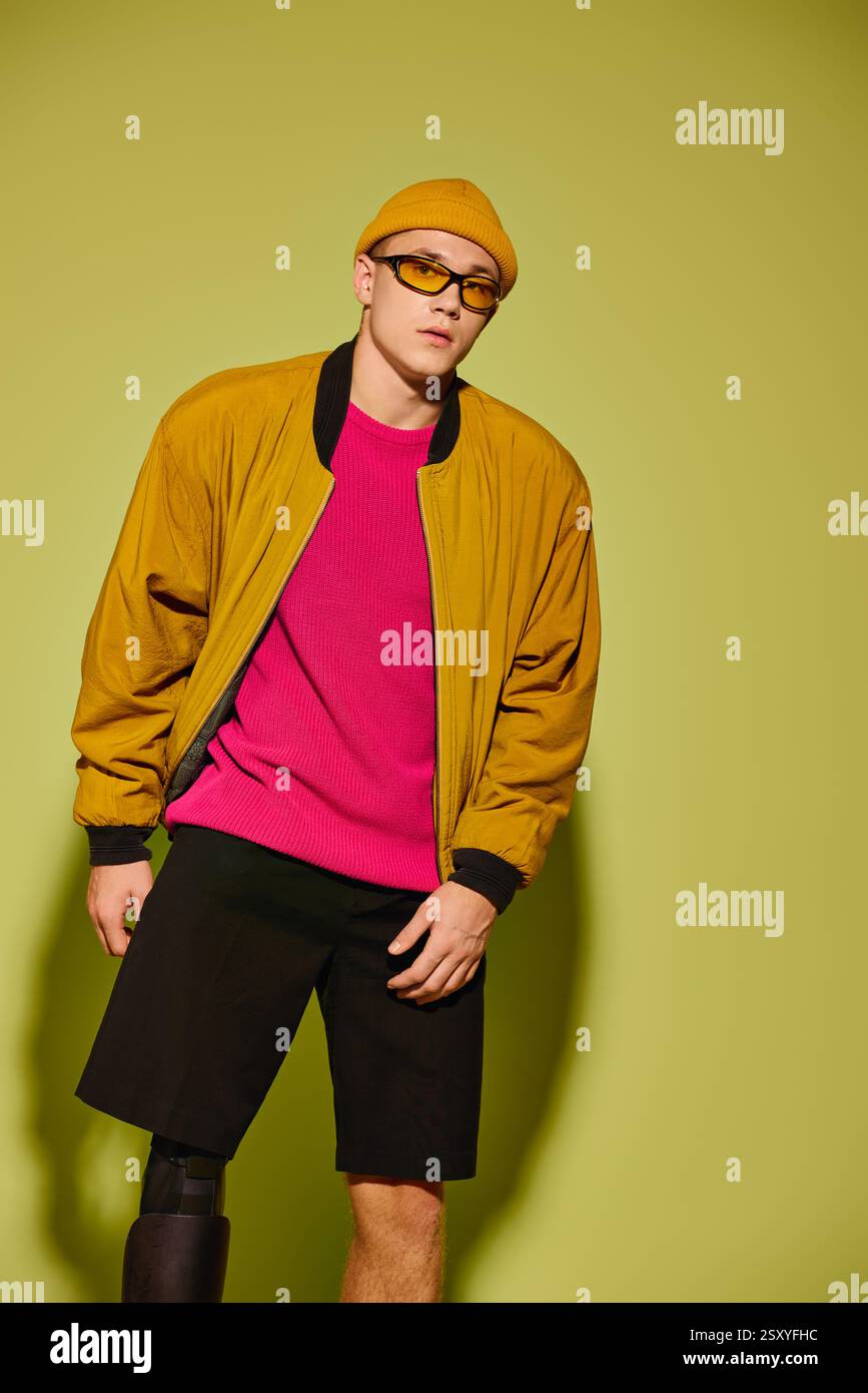 Handsome young man poses in trendy attire, embracing his identity in a ...