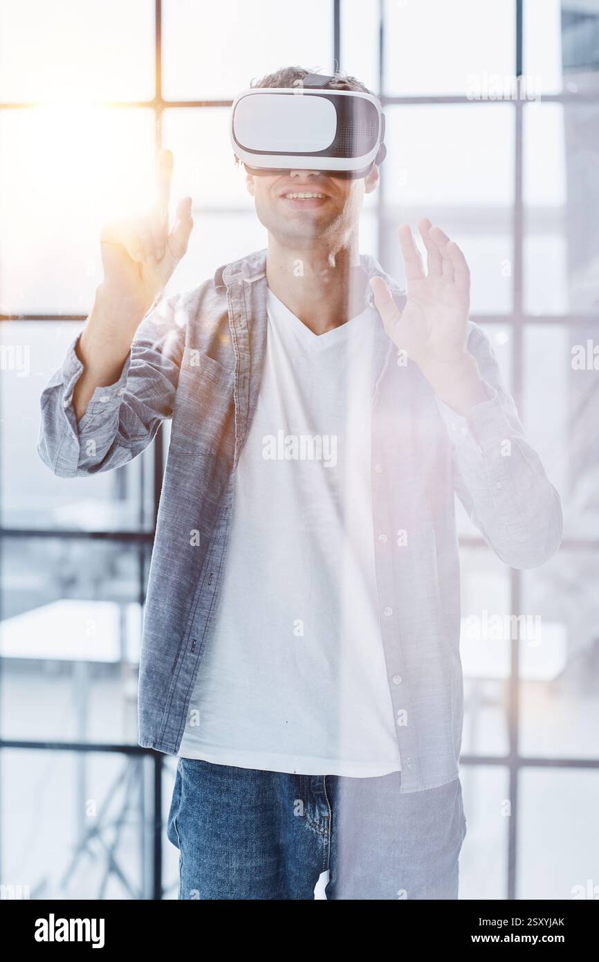Businessman using vr glasses to view educational material and financial documents Stock Photo