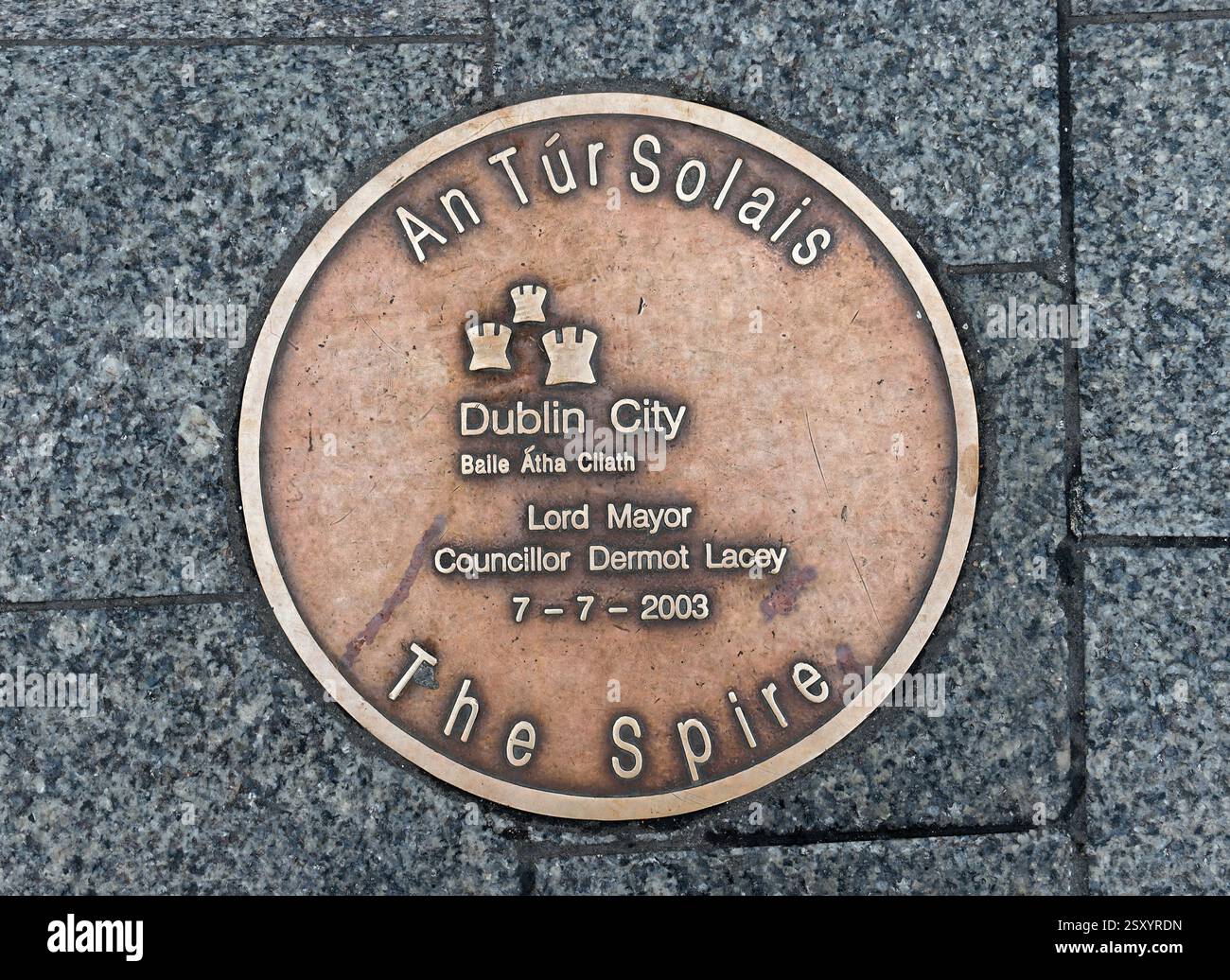 Spire of Dublin. Large, stainless steel, pin-like monument in Dublin, Ireland. Sign on the sidewalk. Stock Photo