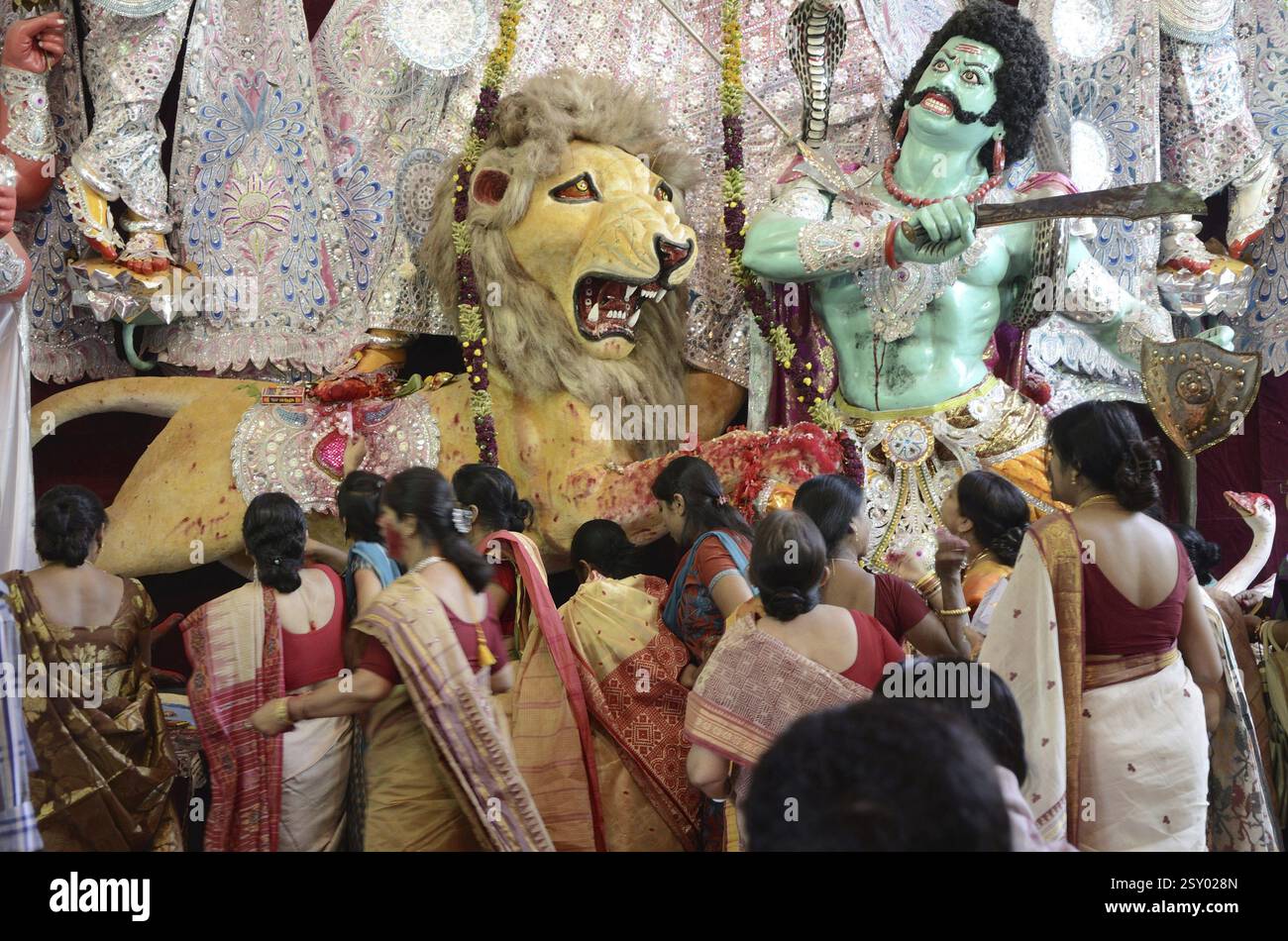 Bengali Women offering Sindur to Idol of Durga in Pandal at Kolkata India Stock Photo