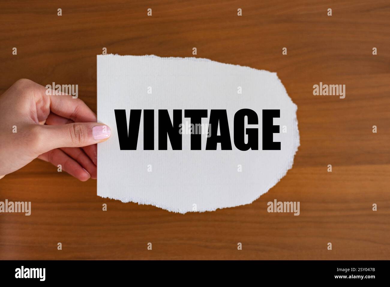 Vintage Vintage. Woman hand holds a piece of paper with a note, vintage. Prime, selection, classic, old, rare. note B1983 vintage Stock Photo