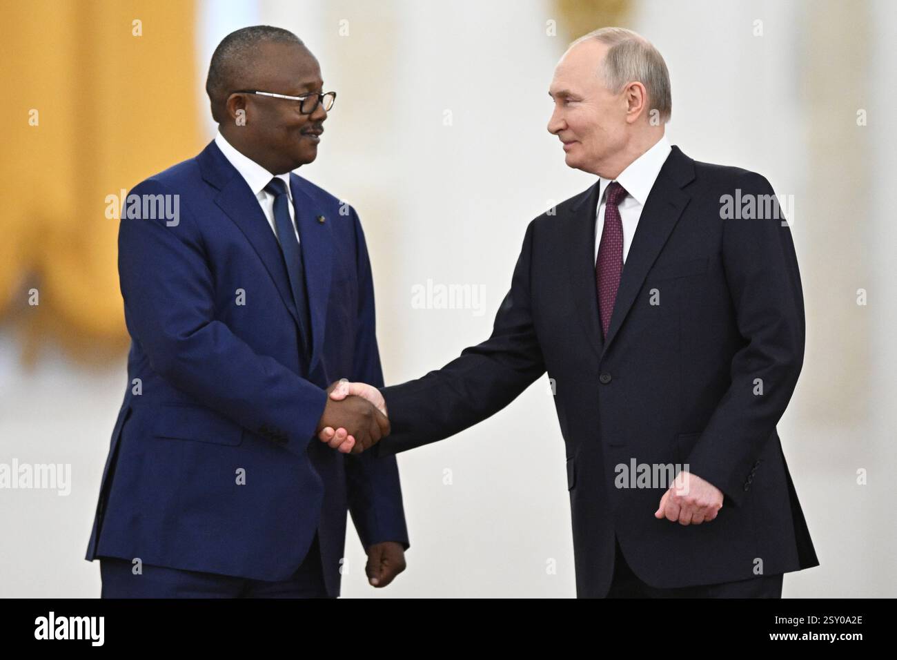 Guinea-Bissau's President Umaro Sissoco Embalo, left, and Russian
