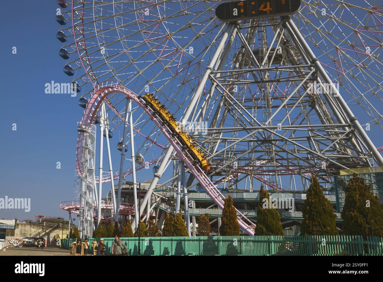 Spining Ride Japan Roller coaster connected to the giant wheel in tokyo, japan Stock Photo ...