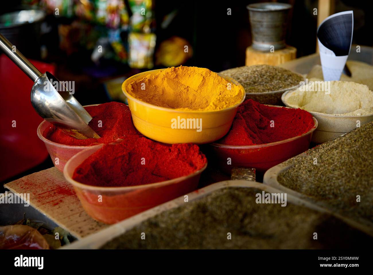 Colorful spice of yellow turmeric powder, red chili and black pepper at street market bazar at Bukhara in Uzbekistan. Stock Photo